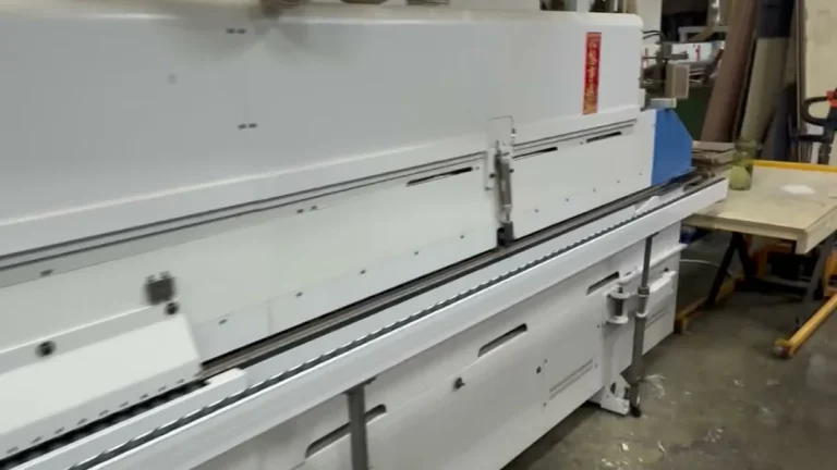 The automatic edge banding line that applies PUR adhesive to panel edges
