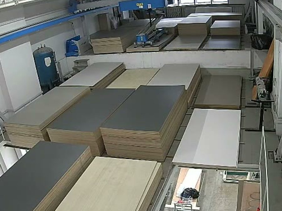 Laminate and board samples laid out for selection on the factory floor